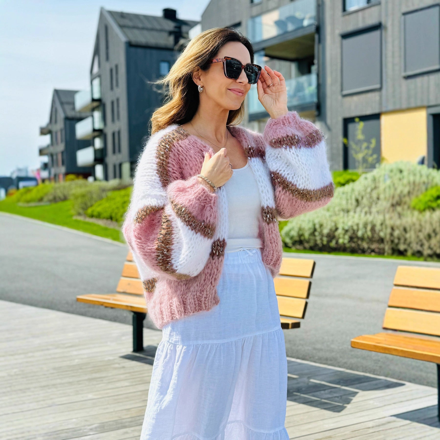 Womens Color Block Cardigan Sweater in pink and white, featuring a cozy knit design, styled casually outdoors.