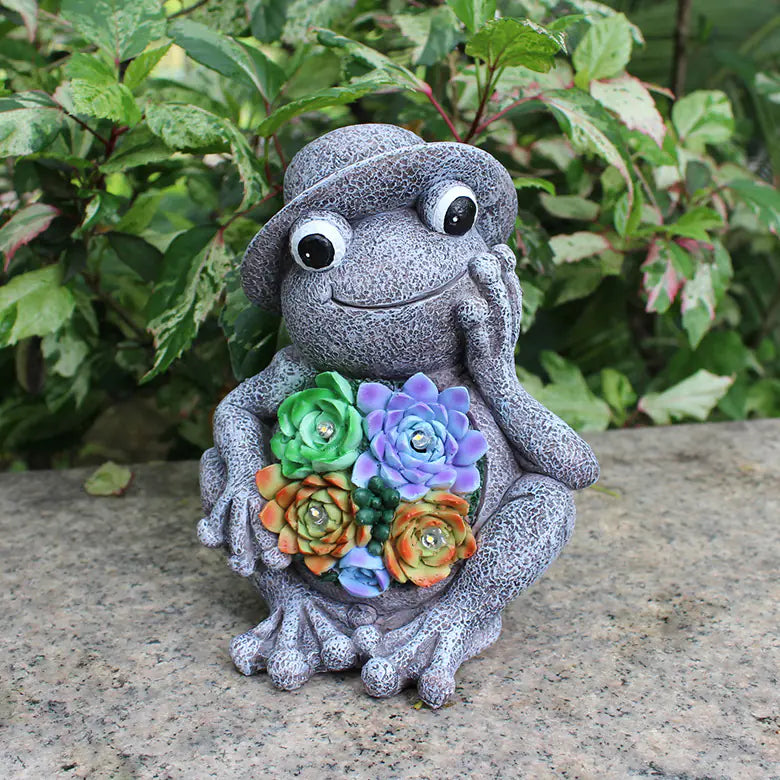 Frog Garden Statue with Solar LED Lights placed among garden plants