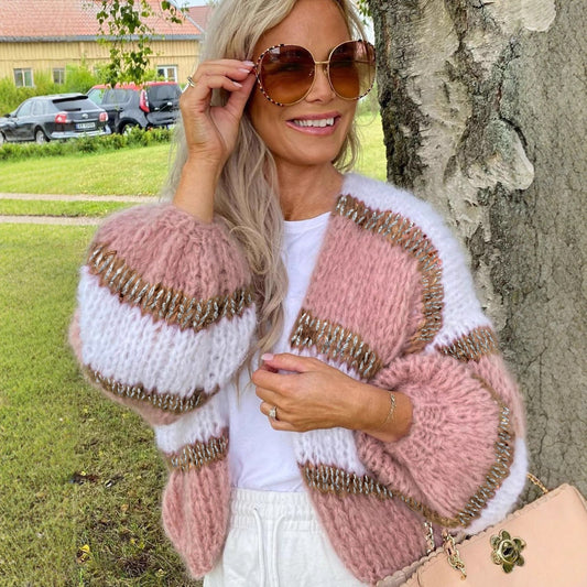 Womens Color Block Cardigan Sweater in pink and white, featuring a cozy knit design, styled casually outdoors.