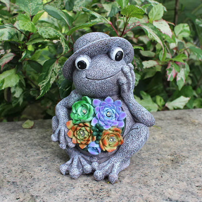 Frog Garden Statue with Solar LED Lights placed among garden plants